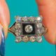 Art Deco Onyx and Diamond target ring, front view of the square centre and scalloped border