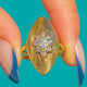 18ct Gold Diamond navette ring, front view of the nine-Diamond star and pointed oval face